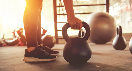 guy lifting kettlebell